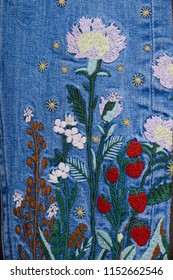 Denim Embroidered Flowers Jeans Texture.
