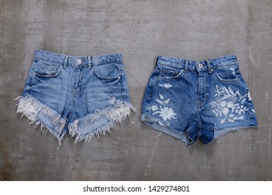 Denim female embroidered flowers pattern jeans shorts.Flat lay. Grey background


 - Powered by Shutterstock