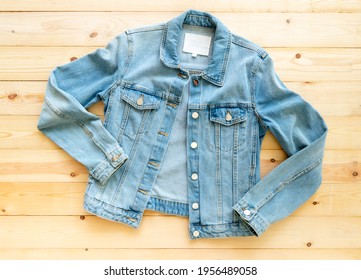 Denim Jacket Jeans Mockup On Brown Wooden Background. Template, Flat Lay