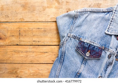 Denim Jacket On Wood Background