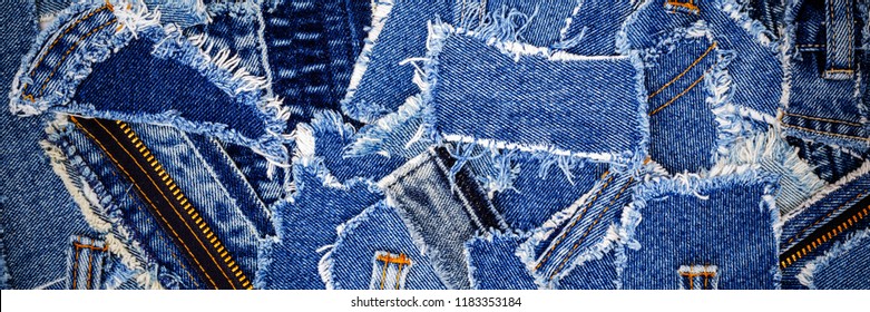 Denim jeans background. Destroyed torn denim blue jeans patches, banner fashion background