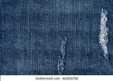 Denim jeans texture or denim jeans background with old torn. Old grunge vintage denim jeans. 
