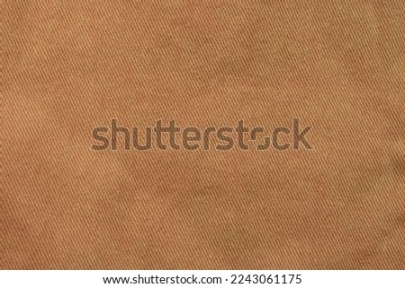 Denim jeans texture or denim jeans background. Jeans pattern. Brown Jeans.