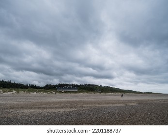 Svinkløv, Denmark - August 21 2022: Svinkløv Badehotel - Beach Hotel - By The North Sea, Under Ominous Rain Clouds.