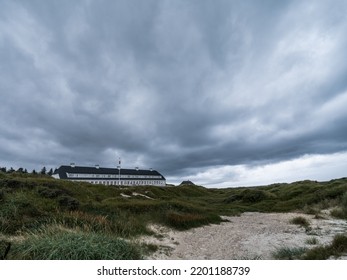 Svinkløv, Denmark - August 21 2022: Svinkløv Badehotel - Beach Hotel - By The North Sea, Under Ominous Rain Clouds.