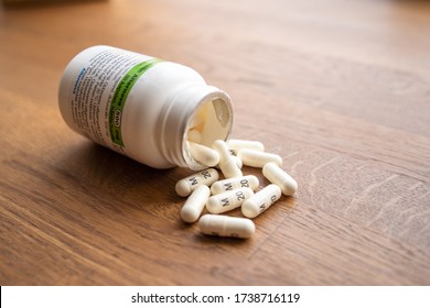 Denmark, Copenhagen 05-23-2020 - Penicillin Pills Laying On A Wood Table With The Can Beside. Pills Laying Spread On The Table. Medication, Medicin