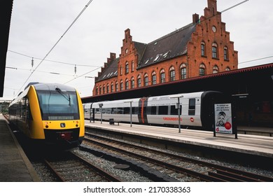 Helsingør, Denmark - Jun 21, 2022: View Of The DSB Railway Train Station In Helsingor (Elsinore). Railways With Black And Yellow Electric Trains Denmark. Central Station Track Area.