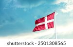 Denmark national flag fluttering. The flag blowing in beautiful soft sky. Denmark national flag for independence day.