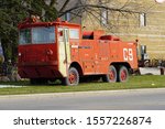 Denmark, Wisconsin / USA - November 9th, 2019: Vintage old US Air Force Airport Crash Rescue Fire Truck sits in front of Antique Shop.