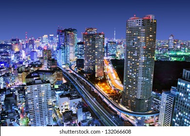 Dense buildings in Minato-ku, Tokyo Japan with Tokyo Sky tree visible on the horizon. - Powered by Shutterstock