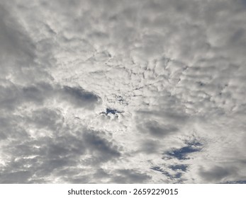 Dense cloud formations in the sky, creating a dramatic and moody atmosphere with varying shades of grey