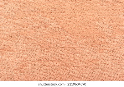 Dense fabric for furniture upholstery in light red, scarlet color. Texture. Material for a seamstress, tailor, fashion designer Foto stock
