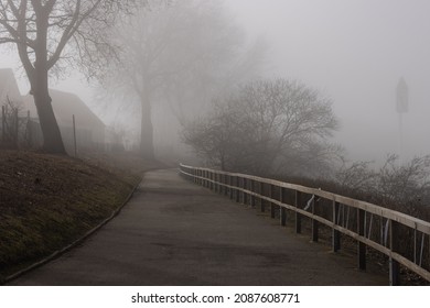Dense fog on a coastal path by the Baltic Sea.
