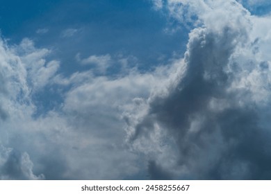 Dense, heavy clouds with rain potential move across the sky. Precipitation due to a decrease in atmospheric pressure to the point of dew.