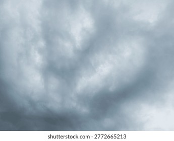 A dense layer featuring overcast clouds fills the frame. The heavy atmosphere suggests impending storm or heavy rain. Darker grey patches mix with lighter tones.

Wispy textures swirl across vast expanses above. These nimbostratus formations create moody aesthetics within landscapes. Muted blue hues emerge beneath thick vapor.

Celestial ceilings display turbulent patterns. Soft light filters through opaque layers, illuminating subtle shifts in depth. Nature presents dramatic backdrops of swirling air.

Greyish colors dominate visual fields, offering somber vibes. Every puff of condensation adds to complex weather arrangements. Moisture hangs suspended within firmaments.

Stormy conditions appear imminent as shadows deepen among billows. A sense of tranquility exists despite brewing squalls. Cold winds seem to guide drifting masses.

Low-hanging mist blends seamlessly into darker elements of scenery. Such overcast skies are typical for late autumn afternoons. High-altitude particles cluster together tightly.

Each puffy section varies in opacity, creating natural contrast. Overall appearance is quite gloomy and monochrome. Rainfall might soon descend from saturated collections.

Vast silhouettes shift slowly under invisible currents. This detailed capture highlights beauty found across tempestuous environments. One can observe many intricate shapes amid gloom.