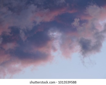 Dense lilac pink clouds of the evening sky - Shutterstock ID 1013539588
