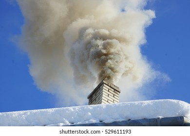 Dense Smoke From A Chimney House