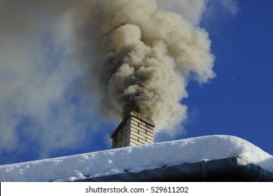 Dense Smoke From A Chimney House