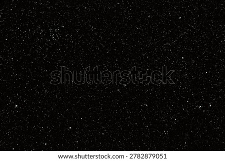 Dense starfield in deep outer space with glowing celestial lights.