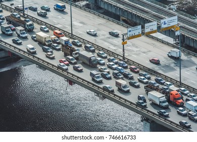 Dense Traffic On The Bridge Over The River