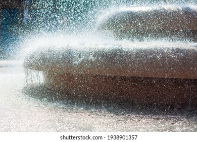 Dense water splashing of fountain in the sunlight - Shutterstock ID 1938901357