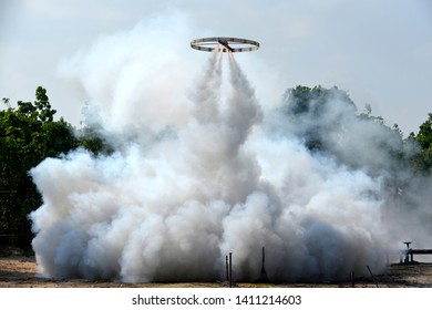 Dense White Smoke Jet Stream From Circular Wing Rocket In A Buddhism Ceremony, Thailand