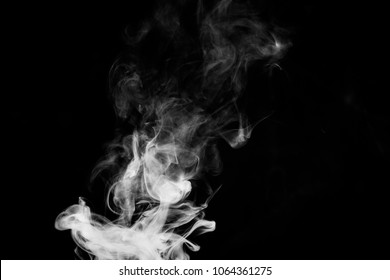 Dense White Smoke On A Black Isolated Background. Background Of Smoke Vape