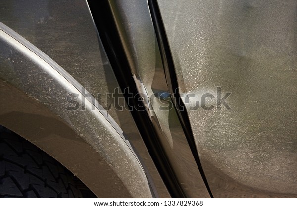 Dent on the door and the pillar of the car, the\
consequences of the\
accident