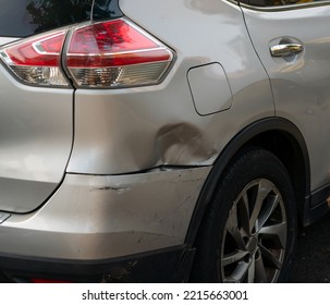 A Dent On The Rear Fender And Bumper Of An SUV In Its Purest Form As A Common Urban Accident