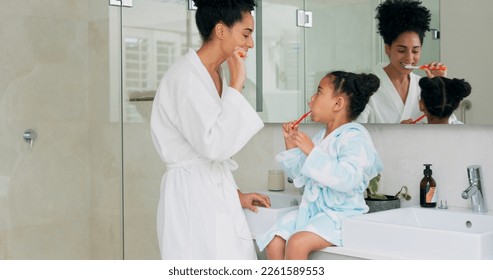 Dental, bathroom and mother and child brushing teeth for oral health, teeth healthcare and cleaning mouth with toothbrush. Black family morning routine, toothpaste and mom teaching self care hygiene - Powered by Shutterstock