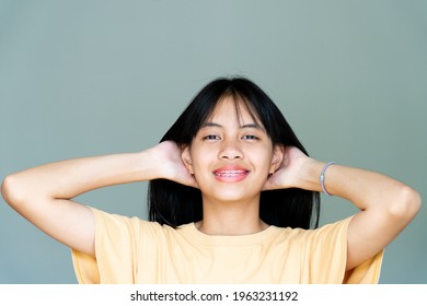 Dental Brace Girl Smiling And Looking To Camera, She Feel Happy And Have Good Attitude With Dentist.  Motivate Kids Not Fear When They Have To Go To Dental Clinic.