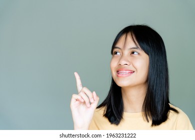 Dental Brace Girl Smiling And Looking To Camera, She Feel Happy And Have Good Attitude With Dentist.  Motivate Kids Not Fear When They Have To Go To Dental Clinic.