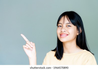 Dental Brace Girl Smiling And Looking To Camera, She Feel Happy And Have Good Attitude With Dentist.  Motivate Kids Not Fear When They Have To Go To Dental Clinic.