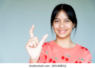 Dental Brace Girl Smiling And Looking To Camera, She Feel Happy And Have Good Attitude With Dentist.  Motivate Kids Not Fear When They Have To Go To Dental Clinic.