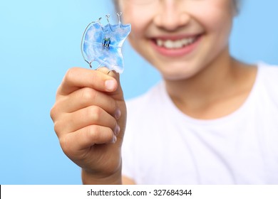 Dental Braces.Child With Orthodontic Appliance.Portrait Of A Little Girl With Orthodontic Appliance .