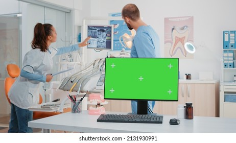 Dental cabinet with horizontal green screen on monitor. Modern dentist office with tools for teethcare and mockup isolated background. Stomatological equipment for oral care and dentition