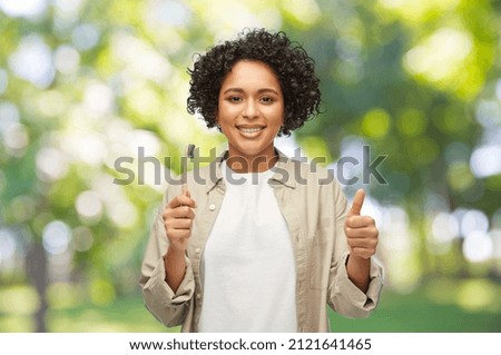 woman showing wooden toothbrush