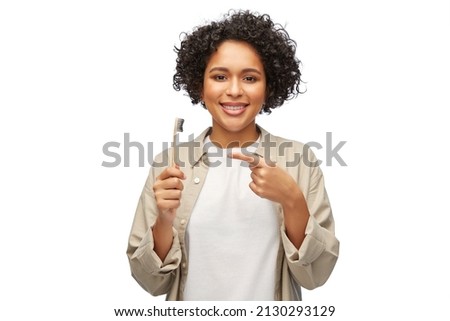 Similar – woman showing wooden toothbrush