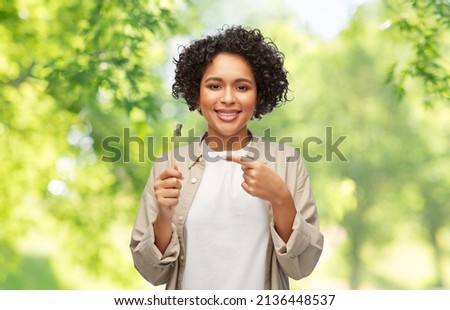 Similar – woman showing wooden toothbrush