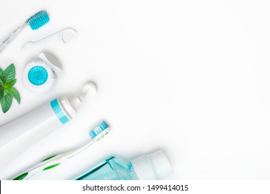 Dental Cleaning Tools And Hygiene Products On White With Copyspace