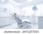 Dental clinic interior blurred background with chair in center, medical tools for tooth care, hygiene maintenance environment in health facility