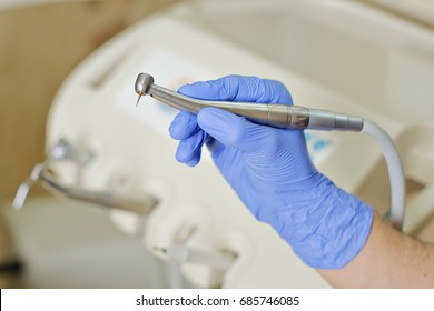 Dental drill in the hands of the dentist 