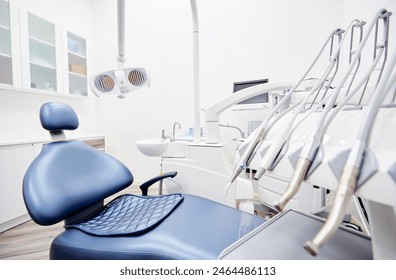 Dental equipment in dentist office in new modern stomatological clinic room. Background of dental chair and accessories used by dentists in blue and white. - Powered by Shutterstock