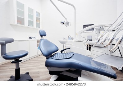 Dental equipment in dentist office in new modern stomatological clinic room. Background of dental chair and accessories used by dentists in blue and white. - Powered by Shutterstock