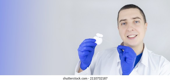 Dental Floss Close Up. Dentist Shows How To Use The Thread Correctly. Different Types Of Flossing. The Concept Of Proper Oral Care. Selective Focus.