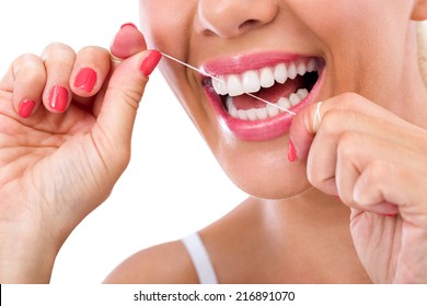 Dental Flush - Woman Flossing Teeth Smiling