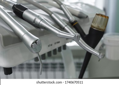Dental handpiece. Equipment and dental instruments in dentist's office. Tools close-up. Dentistry. Stomatological tools. Shallow depth of field.