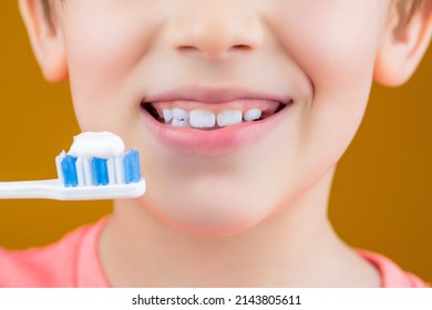 Dental Hygiene. Happy Little Kid Brushing Her Teeth. Kid Boy Brushing Teeth. Boy Toothbrush White Toothpaste. Health Care, Dental Hygiene. Joyful Child Shows Toothbrushes. Little Boy Cleaning Teeth.