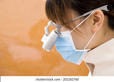 Dental Hygienist Wearing A Binocular Loupe