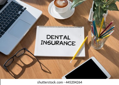 DENTAL INSURANCE open book on table and coffee Business - Shutterstock ID 445204264